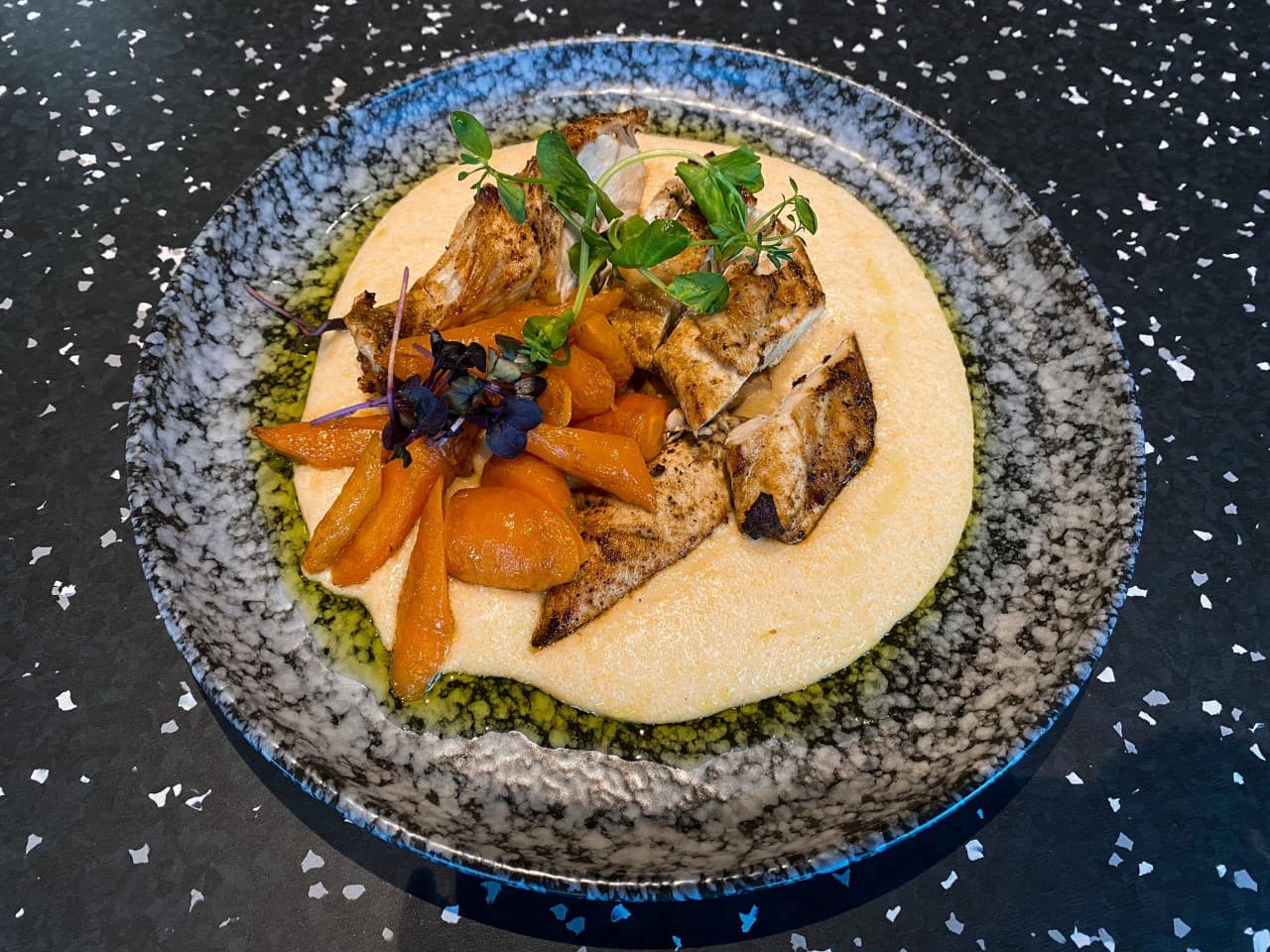 <p>Spicy marinated yellow chicken breast with roasted carrots and creamy polenta</p>