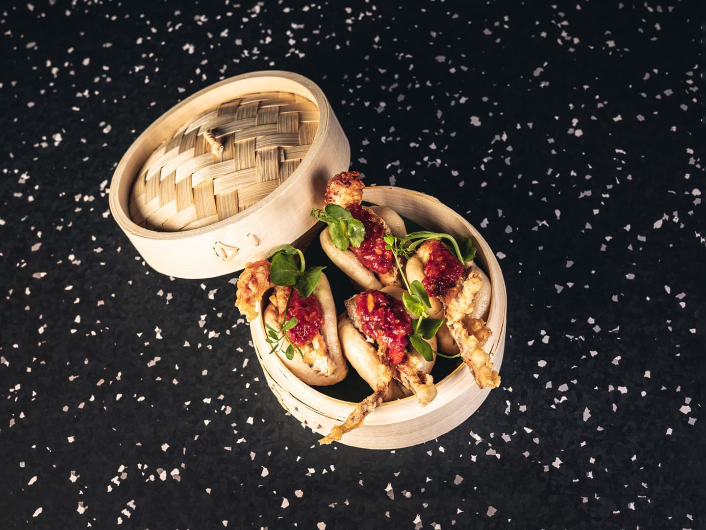 <p>Steamed bao bun, fried soft-shell crab, homemade sambal oelek and garden cress</p>