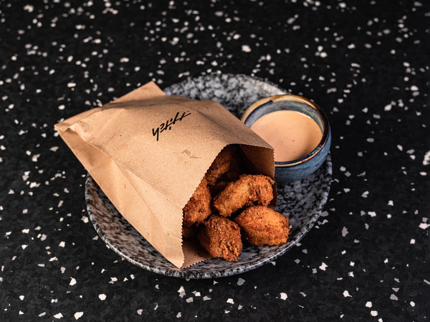 <p>Fried bites of chicken leg with wasabi mayonnaise</p>