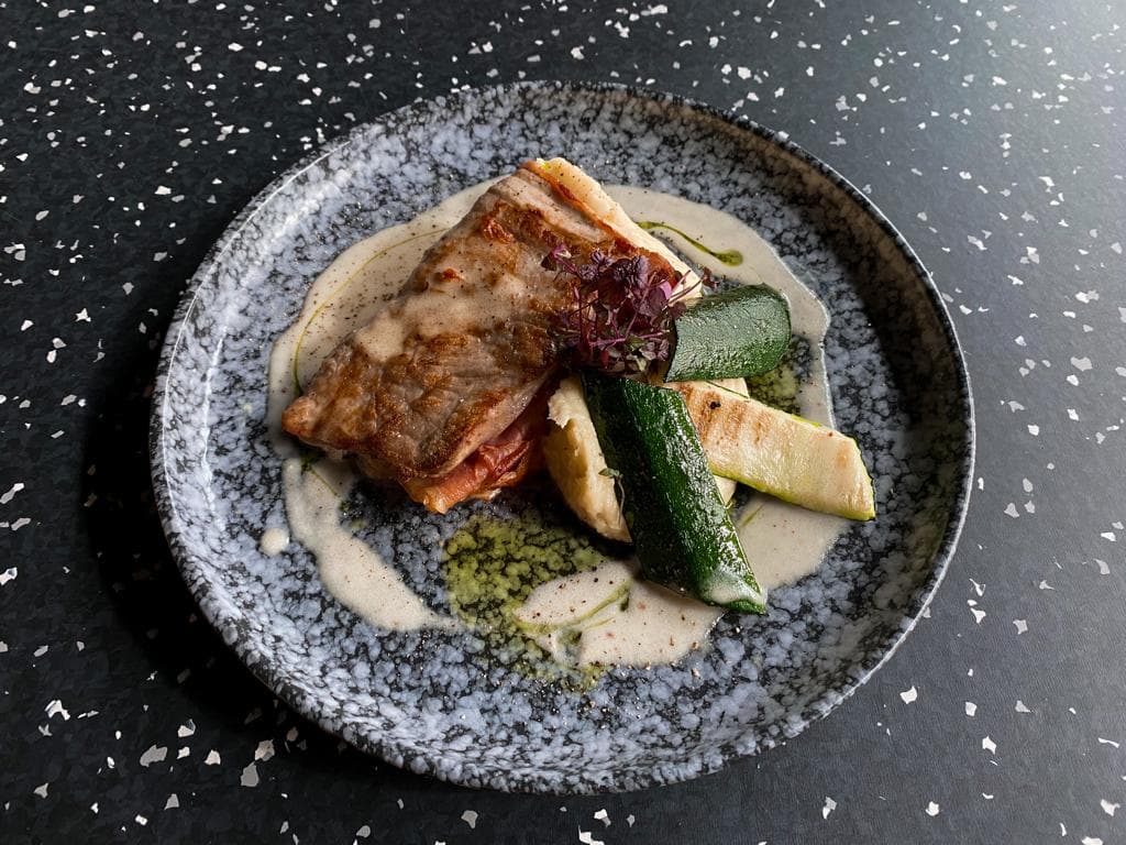 <p>Pork &ldquo;Saltimbocca&ldquo; in white wine sauce with grilled courgette and mashed potatoes</p>