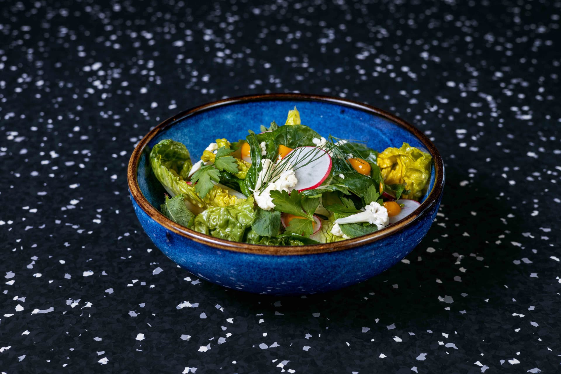 <p>Sucrine lettuce, radish, sliced cauliflower, parsley, mint, sesame, kumquat gel</p>