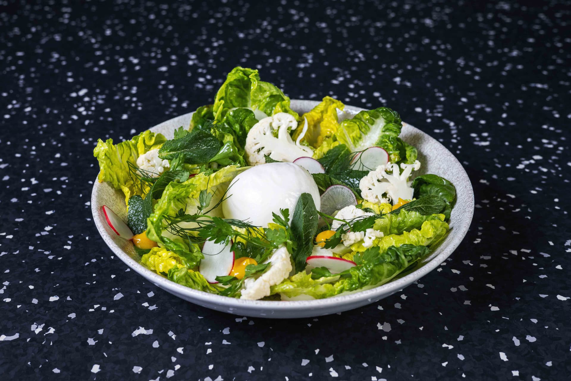 <p>Luxembourgish burrata, sucrine lettuce, radish, cauliflower, parsley, mint, sesame</p>