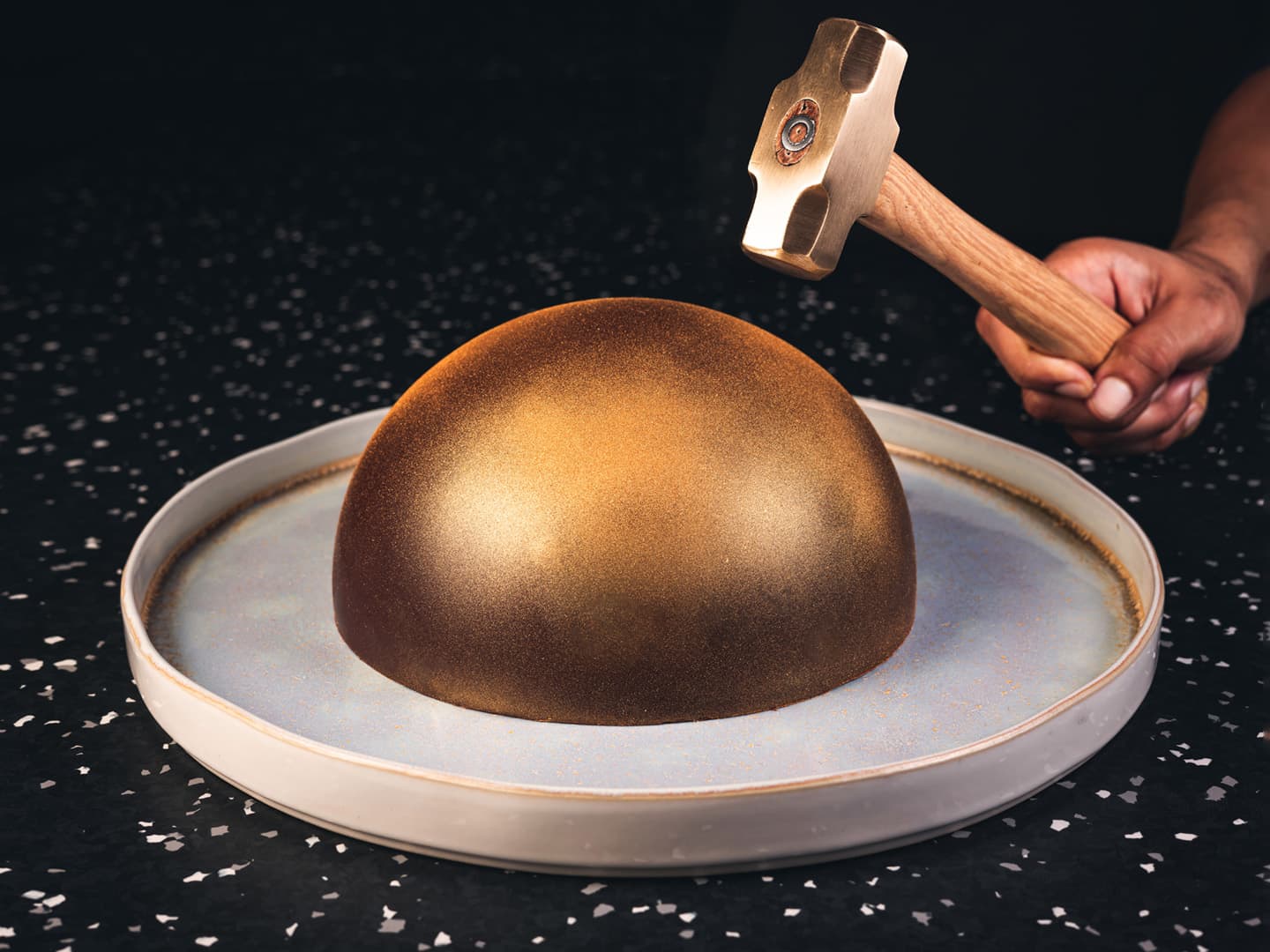 <p>Dark Belgium chocolate dome filled with assorted sweets, mini-desserts and fruits</p>