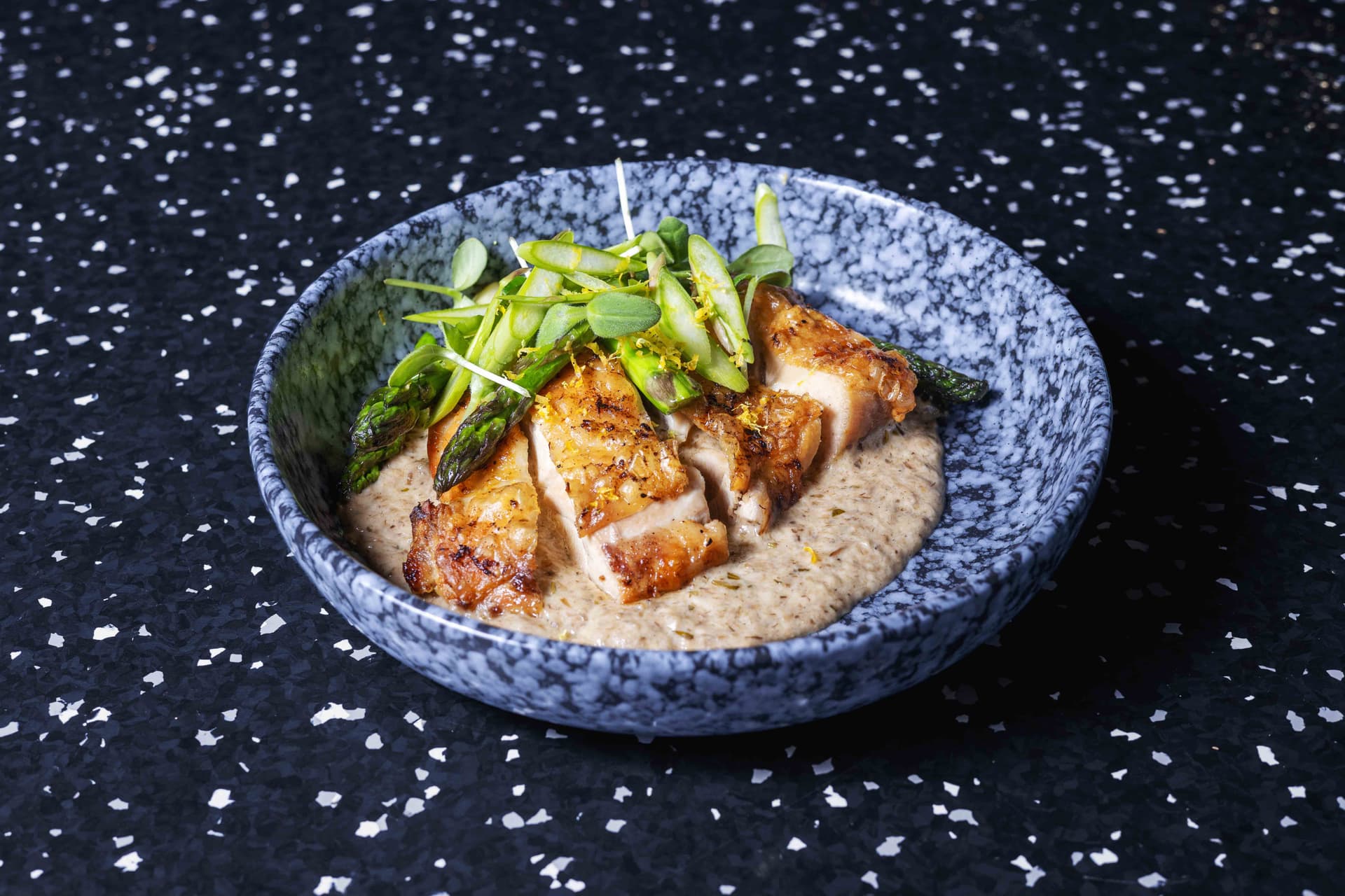 <p>Marinated chicken leg, green asparagus, shiitake mushrooms, chicken jus</p>