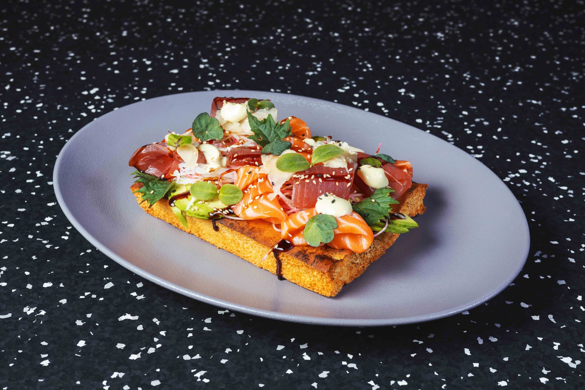 <p>Crunchy baked focaccia, avocado, tuna and salmon sashimi, wasabi mayonnaise, reduced soy sauce, salad, radish, ginger</p>
