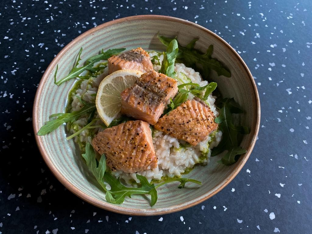<p>Baked salmon with lemon risotto and rocket pesto</p>