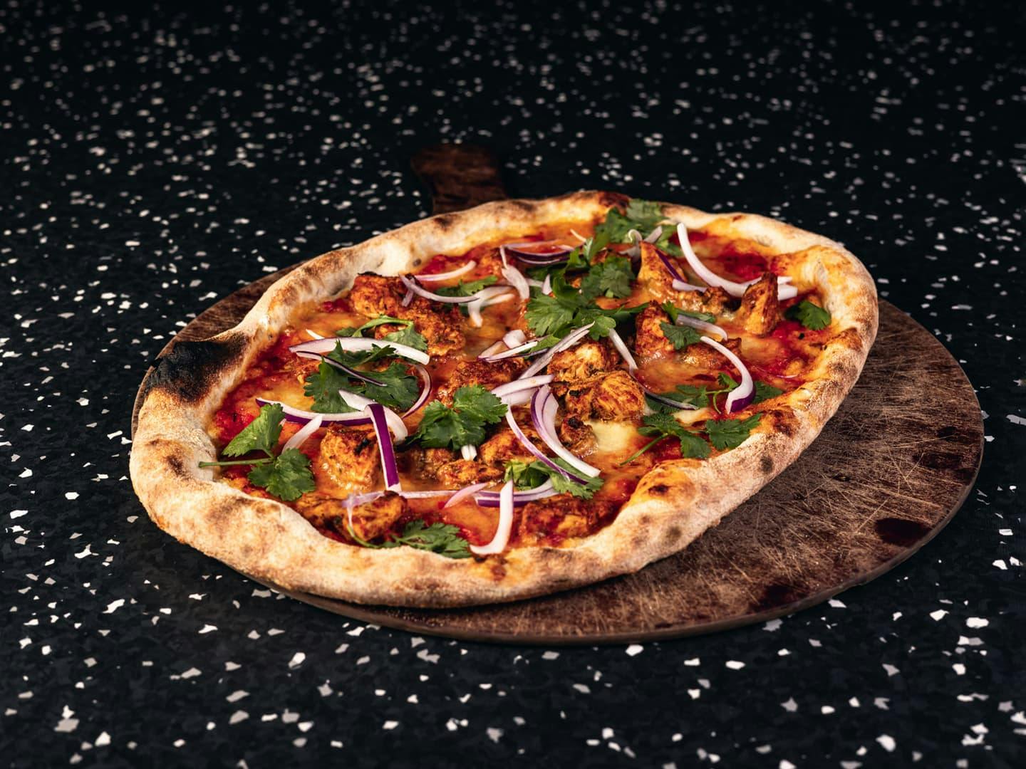 <p>Whole wheat dough, coriander, red onion with marinated chicken</p>