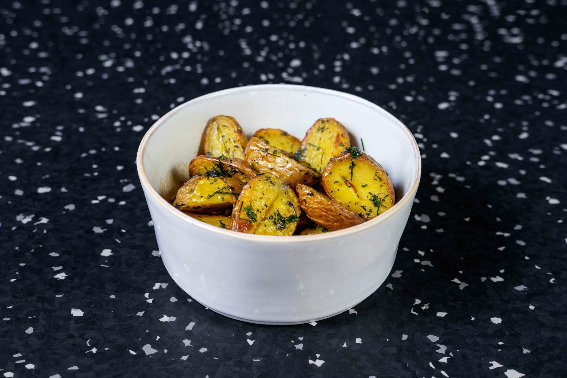 <p>Pan-fried grenaille potatoes with herbal oil</p>
